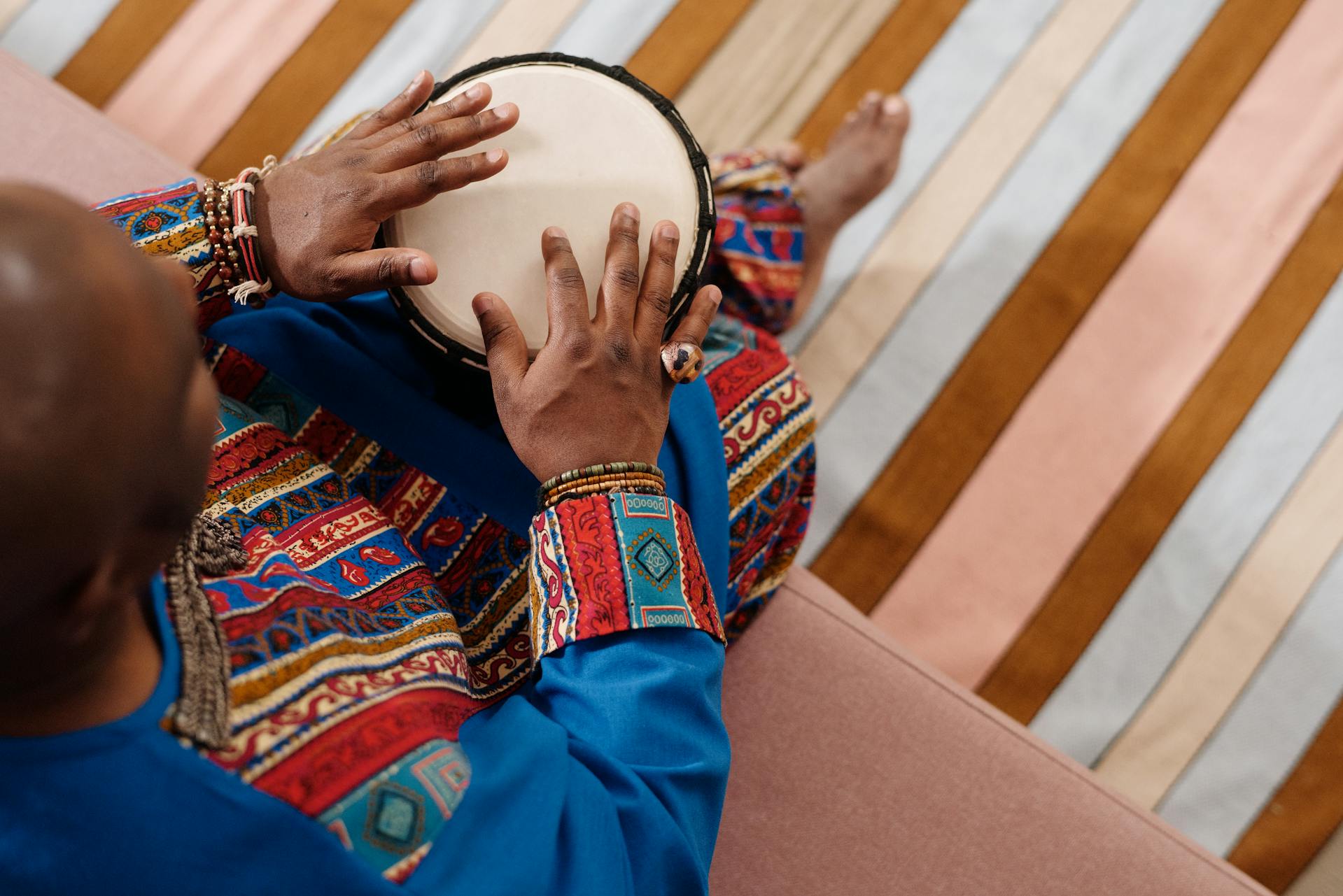 Person Playing Djembe - African Drum